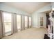 Bright living room with large windows, a fireplace, and neutral-colored walls at 118 Jasmine Way, Carrollton, GA 30180
