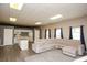 Spacious living room with a modern kitchen, island, and large sectional sofa at 118 Jasmine Way, Carrollton, GA 30180