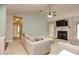 Inviting living room with fireplace and comfortable furnishings at 118 Jasmine Way, Carrollton, GA 30180