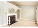 Fireplace area with mantle, decorative candlesticks, and view to other rooms at 118 Jasmine Way, Carrollton, GA 30180