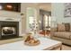 Close-up of living room with fireplace, stylish decor, and comfortable couch at 118 Jasmine Way, Carrollton, GA 30180