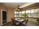 Inviting screened-in patio features a ceiling fan and outdoor dining set at 118 Jasmine Way, Carrollton, GA 30180
