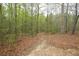 Scenic wooded area with a natural trail, offering a serene escape into nature at 118 Jasmine Way, Carrollton, GA 30180