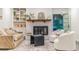 Close up of a fireplace surrounded by shelving and decorated with modern furnishings at 2221 Meadow Wood Ct, Marietta, GA 30062