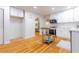 Spacious kitchen area boasts hardwood floors, white cabinets, and stainless steel appliances at 2221 Meadow Wood Ct, Marietta, GA 30062