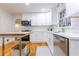 Well-lit kitchen with white cabinets, modern appliances, and a stainless steel dishwasher at 2221 Meadow Wood Ct, Marietta, GA 30062
