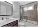 Bathroom with a vanity, toilet, and tiled shower/tub with a sliding glass door at 2342 Terrace View Sw Cir, Atlanta, GA 30315