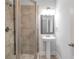 Bathroom with a tiled stand-up shower and pedestal sink at 2342 Terrace View Sw Cir, Atlanta, GA 30315