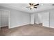 Bedroom featuring trey ceiling, light gray walls and walk in closet at 2342 Terrace View Sw Cir, Atlanta, GA 30315