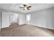 A bright bedroom offers neutral colors and plush carpet, creating a serene and inviting atmosphere at 2342 Terrace View Sw Cir, Atlanta, GA 30315