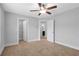 Bedroom showcasing a ceiling fan, carpet, and doors leading to a closet and bathroom at 2342 Terrace View Sw Cir, Atlanta, GA 30315