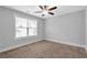 Bedroom featuring neutral walls, a ceiling fan, carpet, and a window with blinds at 2342 Terrace View Sw Cir, Atlanta, GA 30315