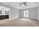 Spacious primary bedroom features a tray ceiling, ceiling fan, and access to a private balcony at 2342 Terrace View Sw Cir, Atlanta, GA 30315
