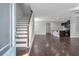 Inviting entryway with hardwood floors, staircase, and open access to the living and kitchen areas at 2342 Terrace View Sw Cir, Atlanta, GA 30315