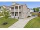 Charming two-story home featuring a double balcony, well-manicured lawn, and a long driveway at 2342 Terrace View Sw Cir, Atlanta, GA 30315