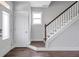 Bright foyer featuring hardwood floors, stairs with white risers, and natural light from a window at 2342 Terrace View Sw Cir, Atlanta, GA 30315