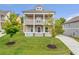Beautiful two-story home with a double balcony, a well-kept lawn, and a welcoming front porch at 2342 Terrace View Sw Cir, Atlanta, GA 30315