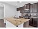 Kitchen island featuring granite countertops and stainless steel appliances at 2342 Terrace View Sw Cir, Atlanta, GA 30315