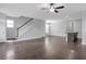 Open concept living room features a staircase and kitchen island at 2342 Terrace View Sw Cir, Atlanta, GA 30315