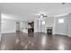 Spacious living room boasts hardwood floors, a ceiling fan, and an inviting fireplace at 2342 Terrace View Sw Cir, Atlanta, GA 30315