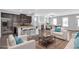 Open-concept living space with kitchen, fireplace, and large windows for natural light at 2342 Terrace View Sw Cir, Atlanta, GA 30315