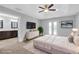 Main bedroom featuring trey ceilings, ensuite bath, and French doors to balcony at 2342 Terrace View Sw Cir, Atlanta, GA 30315