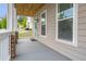 Inviting front porch featuring a covered ceiling, brick pillars, and a view of the neighborhood at 2342 Terrace View Sw Cir, Atlanta, GA 30315