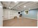 Unfinished basement with open ceiling, shelving, and carpet flooring, ready for customization at 1865 Briarlake Cir, Decatur, GA 30033