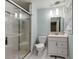 Bright bathroom featuring a glass enclosed shower and modern vanity with updated fixtures at 1865 Briarlake Cir, Decatur, GA 30033