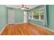 Bedroom with wood floors, large window and double closet at 1865 Briarlake Cir, Decatur, GA 30033