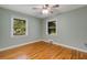 Bedroom boasting shining hardwood floors and dual windows that fill the room with sunlight at 1865 Briarlake Cir, Decatur, GA 30033