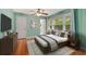 Bedroom with wood floors, large window and stylish decor at 1865 Briarlake Cir, Decatur, GA 30033