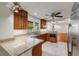 Well-lit kitchen boasting granite countertops, stainless steel appliances, and a breakfast bar at 1865 Briarlake Cir, Decatur, GA 30033