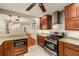 Kitchen features granite countertops, stainless steel appliances and cherry cabinets at 1865 Briarlake Cir, Decatur, GA 30033
