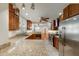 Modern kitchen featuring stainless steel appliances, granite countertops, and wood cabinets at 1865 Briarlake Cir, Decatur, GA 30033