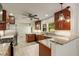 Updated kitchen with stainless steel appliances, granite countertops, tile floors and cherry cabinets at 1865 Briarlake Cir, Decatur, GA 30033