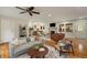 Comfortable living room with hardwood floors, stone fireplace, and open access to the dining area at 1865 Briarlake Cir, Decatur, GA 30033