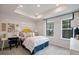 Comfortable bedroom with tray ceiling, two windows with views, and a cozy bed with decorative pillows at 210 Maycrest Path, Tucker, GA 30084