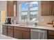 Bright kitchen with modern stainless steel appliances, tile backsplash, and an exterior view at 210 Maycrest Path, Tucker, GA 30084