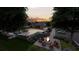 Community pool, fire pit, and lounge area at dusk at 210 Maycrest Path, Tucker, GA 30084