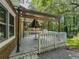Back deck with table, umbrella, and a covered seating area at 5841 Covered Wagon Trl, Lilburn, GA 30047