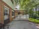 Backyard patio with deck, grill, seating, and wooded view at 5841 Covered Wagon Trl, Lilburn, GA 30047