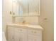 Bathroom vanity with sink, medicine cabinet, drawers, and gold hardware at 5841 Covered Wagon Trl, Lilburn, GA 30047
