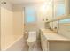 This bathroom features tile floors, white vanity, and a shower-tub combination at 5841 Covered Wagon Trl, Lilburn, GA 30047