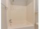 Bright bathtub in bathroom with shower and towel rack at 5841 Covered Wagon Trl, Lilburn, GA 30047