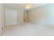 This bedroom includes carpet flooring, a closet, and natural light from the windows at 5841 Covered Wagon Trl, Lilburn, GA 30047