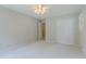 This bedroom features carpet floors, a ceiling fan, a closet, and natural light at 5841 Covered Wagon Trl, Lilburn, GA 30047