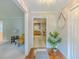 Warm foyer with hardwood floors, view to kitchen, and decorative mirror, creating a welcoming entry at 5841 Covered Wagon Trl, Lilburn, GA 30047