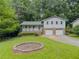 Well-maintained home with front yard, two car garage, and covered porch at 5841 Covered Wagon Trl, Lilburn, GA 30047
