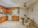 Bright kitchen with wooden cabinetry and eat-in dining area at 5841 Covered Wagon Trl, Lilburn, GA 30047